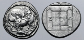 Macedon, Akanthos AR Tetradrachm. Circa 470-430 BC. Bull collapsing to left, head raised, attacked and mauled by lion upon his back to right; tunny fi...