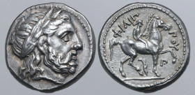 Kingdom of Macedon, Philip II AR Tetradrachm. Amphipolis, circa 323-317 BC. Laureate head of Zeus to right / Youth on horseback to right, holding rein...