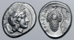 Cilicia, Soloi AR Stater. Circa 410-375 BC. Head of Athena to right, wearing helmet decorated with griffin / Grape bunch on vine with leaf and tendril...