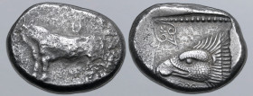 Cyprus, Paphos AR Stater. Pny-, circa 460-425 BC. Bull walking to left; 'Pu' in Cypriot script above / Eagle's head to left, palmette above, pattern b...