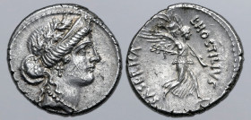 L. Hostilius Saserna AR Denarius. Rome, 48 BC. Diademed female head to right, wearing oak wreath / Victory walking to right, holding trophy, palm and ...