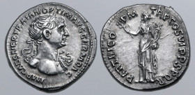Trajan AR Denarius. Rome, AD 116-117. IMP CAES NER TRAIAN OPTIM AVG GERM DAC, laureate bust to right, wearing aegis / PARTHICO P M TR P COS VI P P S P...