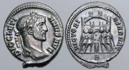 Diocletian AR Argenteus. Rome, AD 295-297. DIOCLETIANVS AVG, laureate head to right / VICTORIA SARMAT, four tetrarchs sacrificing over tripod before c...