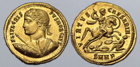 Crispus, as Caesar, AV Solidus. Nicomedia, AD 324-325. FL IVL CRISPVS NOB CAES, laureate 'heroic' bust to left, seen from behind, holding spear and sh...