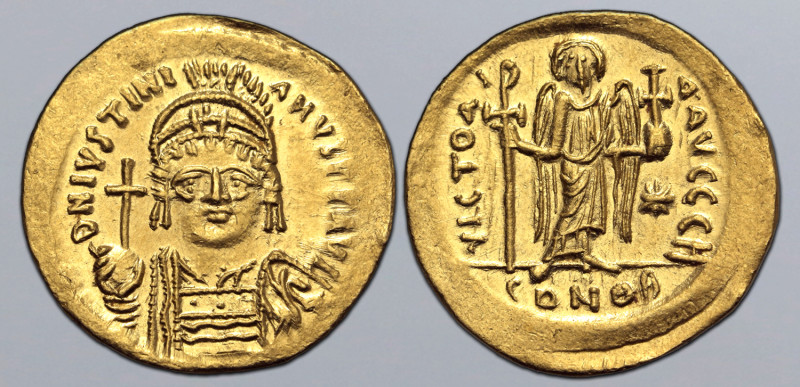 Justinian I AV Solidus. Constantinople, AD 545-565. D N IVSTINIANVS P P AVC, hel...