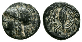 AEOLIS, Elaia. Ae10. (Ae. 1,36g/10mm). 340-300 a.C. (SNG Copenhagen 169-170; SNG von Aulock 1605). Anv: Cabeza de Atenas a izquierda. Rev: Espiga dent...