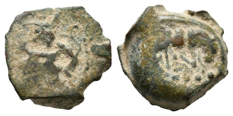 EBUSUS (Ibiza). 1/8 Calco. (Ae. 1,14g/11mm). 200-100 a.C. (FAB-924). Anv: Bes co...
