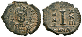 JUSTINIANO I. Decanummium. (Ae. 3,80g/23mm). 546-547 d.C. Theupolis. (Seaby 236). Anv: Busto coronado y con coraza de Justiniano I de frente portando ...