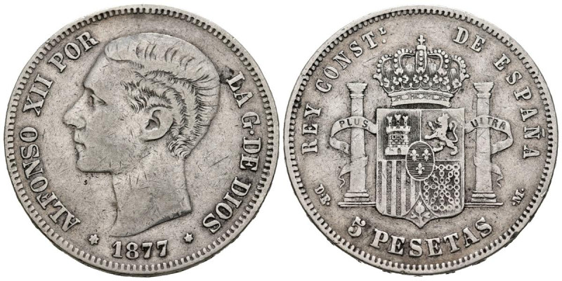 ALFONSO XII (1874-1885). 5 Pesetas (Ar. 24,55g/37mm). 1877. Estrellas apenas vis...