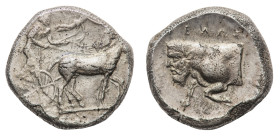 Gela - Tetradrachm 450-440 BC - Obverse: Charioteer, holding kentron in right hand and reins in left, driving slow quadriga right; above Nike flying r...