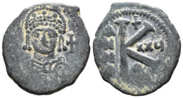 (Bronze, 8.11g 26mm)

BYZANTINE EMPIRE.

Justinian I. 527-565. Æ half follis