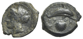 Sicily, Syracuse, c. 415-405 BC. Æ Hemilitron (18.5mm, 3.19g, 1h). Head of Arethusa l., hair bound in ampyx and sphendone; two leaves to r. R/ Dolphin...