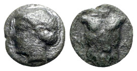 Ionia, Magnesia ad Maeandrum, c. 400 BC. Æ (7mm, 0.55g, 3h). Laureate head of Apollo l. R/ Cuirass. SNG Kayhan 393-4. Rare, green patina, VF