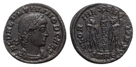 Delmatius (Caesar, 335-337). Æ Follis (16mm, 1.75g, 6h). Nicomedia, 336-7. Laureate, draped and cuirassed bust r. R/ Two soldiers standing facing one ...