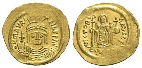 Maurice Tiberius (582-602). AV Solidus (22mm, 4.46g, 6h). Constantinople, 583/4-602. Helmeted, draped and cuirassed bust facing, holding globus crucig...