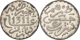 MAROC
Hassan Ier (1873-1894). Dirham AH 1311 (1894), Paris.NGC MS 66 (3481307-075).
Av. Légende et (date). 
Rv. Légende.
Lec.118 ; Argent - 2,91 g - 1...