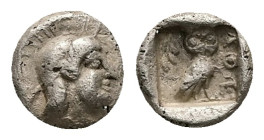 Attica, Athens. AR Hemiobol, 0.40 g 7.08 mm. Circa 454-404 BC.
Obv: Helmeted head of Athena right.
Rev: AΘΕ, Owl standing right, head facing; olive sp...