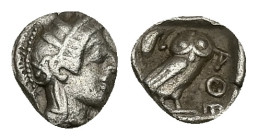 Attica, Athens. AR Hemiobol, 0.30 g 7.42 mm. Circa 454-404 BC.
Obv: Helmeted head of Athena right.
Rev: AΘΕ, Owl standing right, head facing; olive sp...