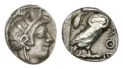 Attica, Athens. AR Obol, 0.60 g 9.55 mm. Circa 454-404 BC.
Obv: Helmeted head of Athena right.
Rev: AΘE, Owl standing right, head facing; olive sprig ...