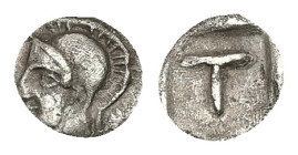 Arkadia, Tegea. AR Tetartemorion. 0.16 g 6.72 mm. Circa 423-400 BC.
Obv: Helmeted head of Athena left.
Rev: Large T within shallow incuse square.
Ref:...
