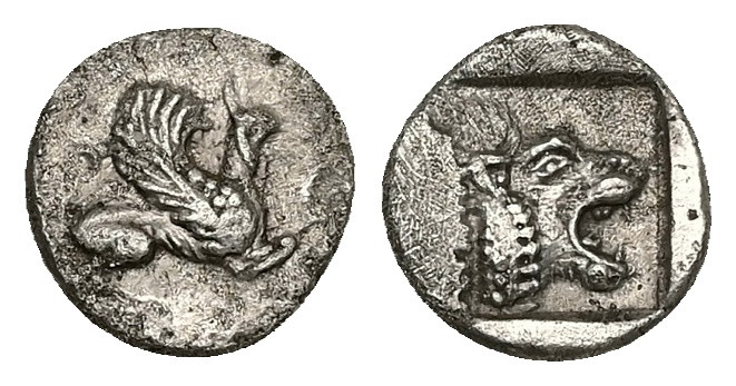 Troas, Assos. AR Obol. 0.70 g 9.62 mm. 5th century BC.
Obv: Griffin seated right...