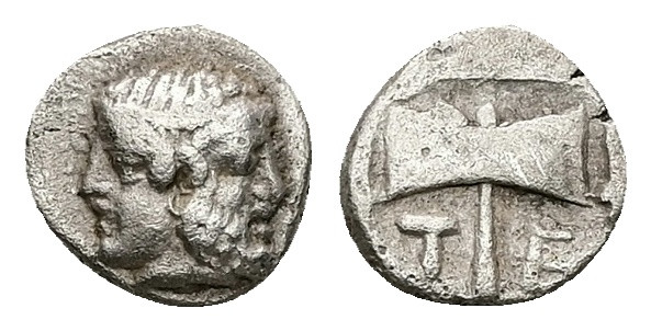 Troas, Tenedos. AR Obol, 0.59 g 8.47 mm. Circa 5th Century BC.
Obv: Janiform hea...