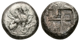 Ionia, Teos. AR Stater, 11.96 g 19.77 mm. Circa 500-450 BC. 
Obv: Griffin with curled wings seated right, raising forepaw; grape bunch on vine to righ...