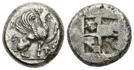 Ionia, Teos. AR Stater, 12.00 g 21.07 mm. Circa 500-450 BC.
Obv: Griffin with curled wings seated right, raising forepaw; grape bunch on vine to righ...