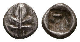 Caria, Rhodos. Kamiros. AR Hemiobol, 0.89 g 9.19 mm. Circa 550-500 BC. 
Obv: Fig leaf 
Rev: Square incuse with raised geometric pattern. 
Ref: HN Onli...