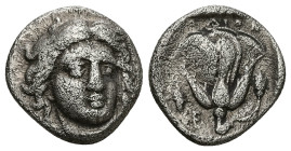 Caria, Rhodos. AR Didrachm, 6.14 g 19.12 mm. Circa 340-316 BC. 
Obv: Head of Helios facing, turned slightly to right. 
Rev: POΔION, Rose with bud to r...