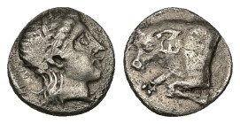 Caria, Uncertain ('Mint E'). AR Diobol, 1.23 g 10.74 mm. Circa 380-340 BC. 
Obv: Head of young male right 
Rev: Forepart of bull left, Carian letter y...
