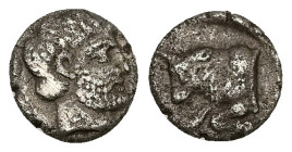 Caria, Uncertain ('Mint E'). AR Diobol, 1.28 g 10.39 mm. Circa 380-340 BC. 
Obv: Head of male right, wearing beard 
Rev: Forepart of bull left; Carian...