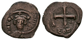 Phocas, AD 602-610. AE, Decanummium. 2.47 g. 20.84 mm. Constantinople. Oversturck.
Obv: DNFOC-A[PERP AVG], crowned with pendilia, mantled bust facing....