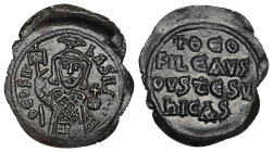 Theophilus, AD 830-842. AE, Follis. 3.79 g. 25.85 mm. Constantinople.
Obv: ΘEOFIL-bASIL. Crowned, three-quarter length figure of Theophilus facing, pe...