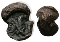 Roman conical lead seal (c. AD 1st–3th centuries)
Obv: Gryllos (an eagle, with a body formed of a janiform head and the legs of a cock) standing, r; ...