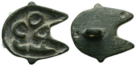 AE Byzantine bronze bread-stamp (AD 5th–6th centuries) 
A bronze bread-stamp formed as a crescent containing letters; handle on the plain back.
Weight...