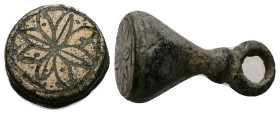 AE Byzantine bronze stamp seal (c. AD 10th century or later)
Bronz estamp seal of conical form, a large suspension loop above horizontal ridge. Floral...