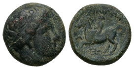 Kings of Macedon, Philip II. Ae. 6.08 g 17.43 mm. 359-336 BC. 
Obv: Diademed head of Apollo right.
Rev: ΦΙΛΙΠΠΟΥ, Naked youth on horse left; trident b...