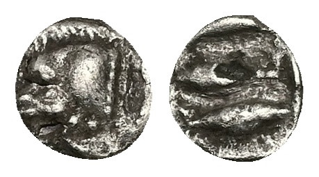 Mysia, Kyzikos. AR Tetartemorion, 0.19 g 6.87 mm. Circa 450-400 BC.
Obv: Forepar...