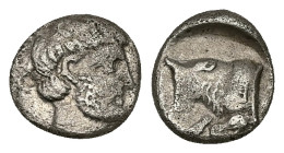 Caria, Uncertain ('Mint E'). AR Diobol, 1.11 g 10.35 mm. Circa 380-340 BC. 
Obv: Head of male right, wearing beard 
Rev: Forepart of bull left; Carian...