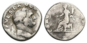 Vespasian, 69-79 AD. AR, Denarius. 3.00 g. 16.99 mm. Rome.
Obv: Head of Vespasian, laureate, right.
Rev: Concordia (?) seated, left; holding patera an...