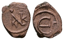 Justin II, AD 565-578. AE, Decanummium. 1.76 g. 16.03 mm. Constantinople.
Obv: Justin II monogram.
Rev: Large Є, officina (Γ) letter to right. 
Ref: S...
