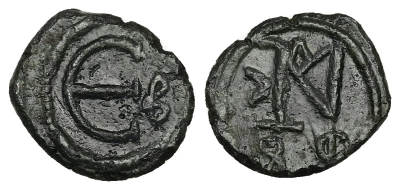 Justin II, AD 565-578. AE, Decanummium. 1.86 g. 15.44 mm. Constantinople.
Obv: J...