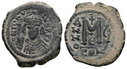 Maurice Tiberius, AD 582-602. AE, Follis. 11.62 g. 30.57 mm. Constantinople.
Obv: DN MAV[RIC] TIBER PP. Helmeted and cuirassed bust facing, holding cr...