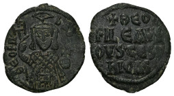 Theophilus, AD 830-842. AE, Follis. 2.79 g. 17.13 mm. Constantinople.
Obv: ΘEOFIL-bAS[IL]. Crowned, three-quarter length figure of Theophilus facing, ...