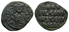 Theophilus, AD 830-842. AE, Follis. 2.79 g. 22.84 mm. Constantinople.
Obv: ΘEOFIL-bASIL. Crowned, three-quarter length figure of Theophilus facing, pe...