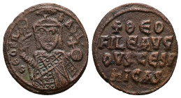 Theophilus, AD 830-842. AE, Follis. 4.00 g. 23.08 mm. Constantinople.
Obv: ΘEOFIL-bASIL. Crowned, three-quarter length figure of Theophilus facing, pe...