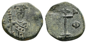 Alexius I Comnenus, AD 1081-1118. AE, Tetarteron. 2.25 g. 16.49 mm. Uncertain mint.
Obv: [AΛEZI] Frontal bust of Alexios I Komnenos wearing stemma, di...