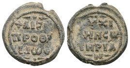 PB Byzantine metrical seal (AD 12th century)
Obv: Inscription of five lines beginning with a cross. Decorations above and below. Border of dots.
Rev: ...