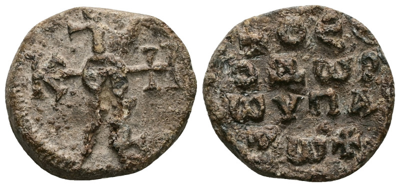 PB Byzantine lead seal of Theodore hypatos (AD 6th–7th centuries)
Obv: Crucifor...